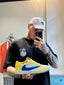 Travis Scott x Air Jordan 1 Retro Low OG SP Canary sneaker.