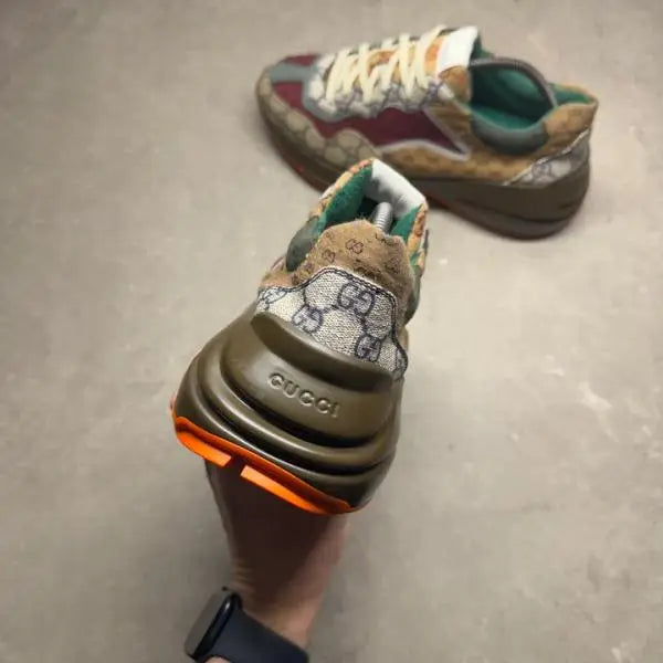 Guccci Rhyton sneakers GG Supreme monogram paneled design GG Supreme monogram