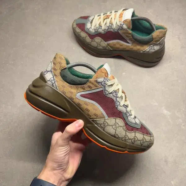 Guccci Rhyton sneakers GG Supreme monogram paneled design GG Supreme monogram