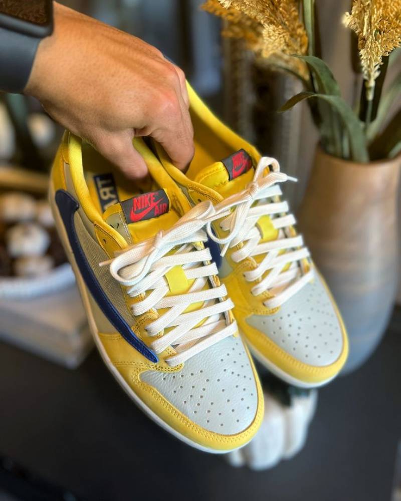 Travis Scott x Air Jordan 1 Retro Low OG SP Canary sneaker.