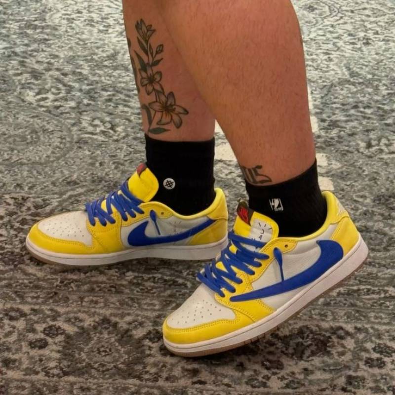 Travis Scott x Air Jordan 1 Retro Low OG SP Canary sneaker.