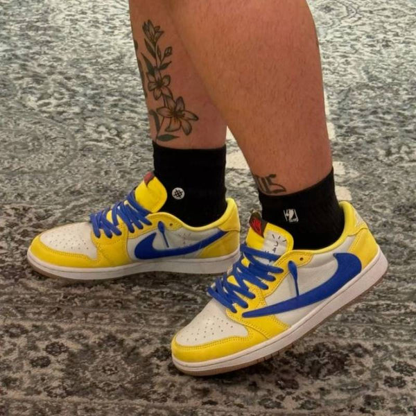 Travis Scott x Air Jordan 1 Retro Low OG SP Canary sneaker.