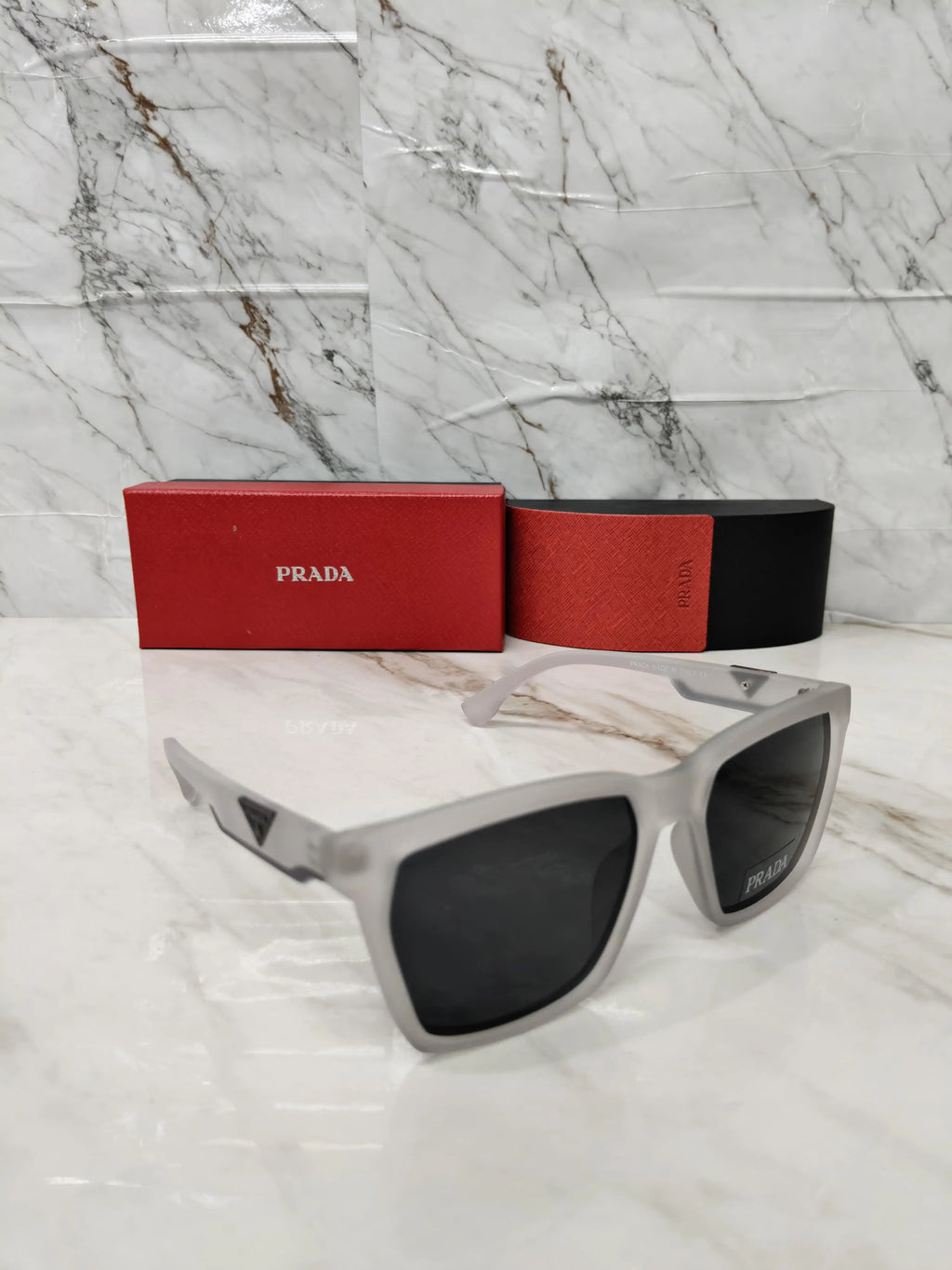 PRADA 0626 TRANSPARENT GREY METAL LOGO 