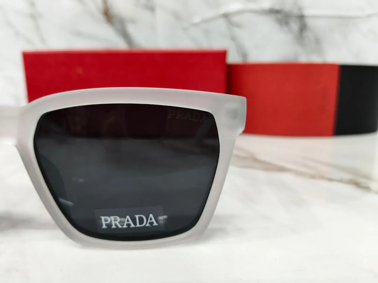 PRADA 0626 TRANSPARENT GREY METAL LOGO 